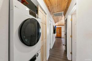 a laundry room with a round mirror on the wall at 3300 Cape Horn home in South Lake Tahoe