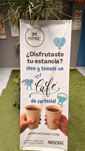 a sign for a cafe with two cups of coffee at Hotel Muy Cdmx, Love Hotel in Mexico City
