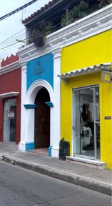 a colorful building on the side of a street at Santa Alejandría Hotel in Cartagena de Indias