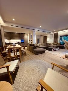 a living room with a couch and a table at eleni's villa in Kandhíla