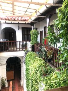 a balcony of a house with lots of plants at Santa Alejandría Hotel in Cartagena de Indias