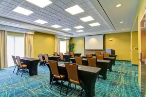a conference room with rows of tables and chairs at SpringHill Suites By Marriott Erie in Erie +29 photos