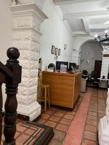 an office with a reception desk in a building at Santa Alejandría Hotel in Cartagena de Indias +80 photos