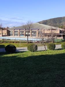 a large building in front of a field of grass at "IL Tulipano" appartamento, o doppia camera quadrupla, con bagno in Sestri Levante