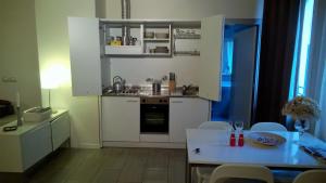 Kuchyňa alebo kuchynka v ubytovaní Agorà Residenza