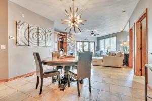 a dining room and living room with a table and chairs at Bridges Bay Resort Coronado Building 302 in Arnolds Park