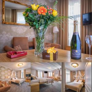 a living room with a vase of flowers and a bottle of wine at Bariseele B&B in Bruges +33 photos