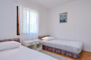 Posteľ alebo postele v izbe v ubytovaní MI Apartment