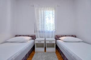 Posteľ alebo postele v izbe v ubytovaní MI Apartment