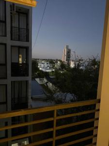 a view of a city from a balcony of a building at Dpto en la costa in Villa María +5 photos