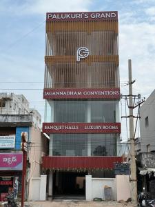 a building with a sign on the side of it at Palukuri's Grand in Vizianagram City