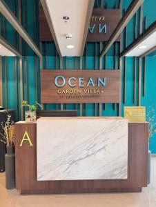 a sign for an ocean garden villas in a lobby at Threeos Cabana in Boracay +16 photos