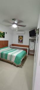 a bedroom with a bed and a ceiling at Depa los corales 3 in Mezcales