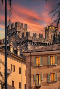 a castle on the top of a building at The Queens House in Bellinzona