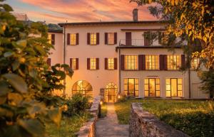 an exterior view of a house at sunset at The Queens House in Bellinzona
