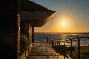 a sunset over the ocean from a house at Playa Vik Jose Ignacio in José Ignacio +67 photos