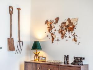 a room with a map of the world on the wall at Haybale Barn in Chatton