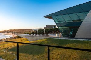 a view of a building and a beach at Playa Vik Jose Ignacio in José Ignacio