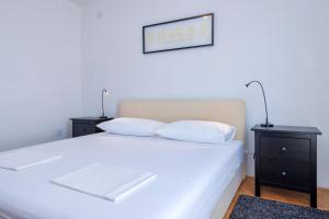 Posteľ alebo postele v izbe v ubytovaní MI Apartment