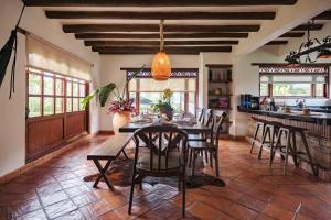 a dining room with a table and chairs at Casa Fiorella in Villa de Leyva