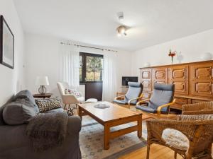 a living room with a couch and chairs and a table at Schwermann in Schmallenberg