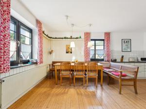 a kitchen and dining room with a table and chairs at Schwermann in Schmallenberg