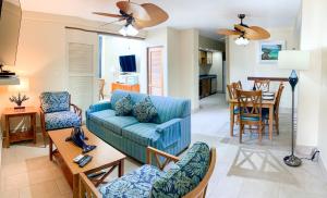 a living room with a couch and chairs and a table at Sea Palace in Philipsburg