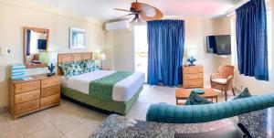 a bedroom with a bed and a living room at Sea Palace in Philipsburg