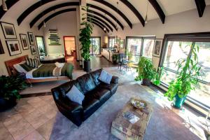 a living room with a couch and a bed at A Heavenly Escape in Halls Gap