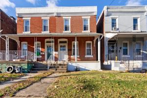an old brick house with a front yard at Candlelight Chamber - Private Room with Shared Space in Chester