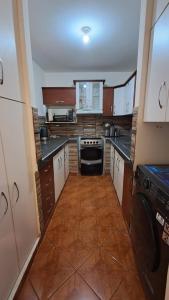 a large kitchen with a stove and a dishwasher at Modern Apartament Pool & Jacuzzi 2 room in Lima +6 photos