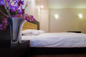 Postel nebo postele na pokoji v ubytování Giotis Boutique Hotel