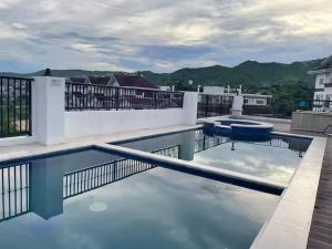a swimming pool on the roof of a building at M&Js Place in Cebu City