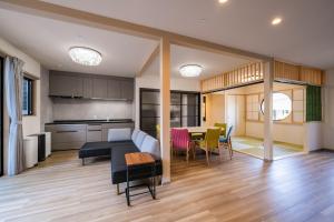 a kitchen and living room with a table and chairs at 花月hanatsuki in Kyoto +40 photos