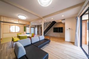 a living room with a couch and a table at 花月hanatsuki in Kyoto