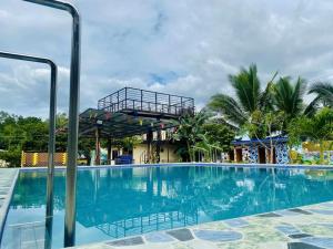 a swimming pool at the resort at Landayan Traveller Inn in Baco Medio Island