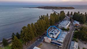 an aerial view of a house next to the water at Harborview Modern Studio 11F in Victor Harbor