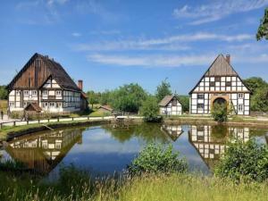 a group of houses next to a river at Nachhaltiges Ferienhaus in Steinheim in Steinheim