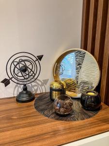 a desk with a mirror and other items on it at Zoned MASLAČAK lux - SPA & Wellness Kopaonik in Kopaonik +25 photos