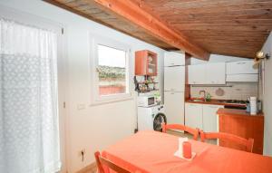 a small kitchen with a table and a window at Casa Giulia 8 in Ragusa