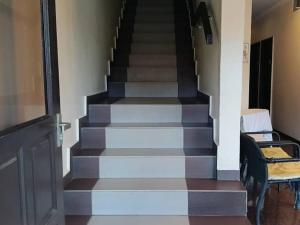 a stairway with a black and white floor at Hotel Remix 2 Cameron Highlands in Brinchang