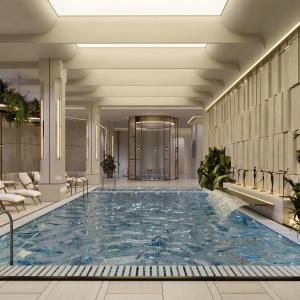 a large swimming pool in a hotel lobby at Radisson Blu Hotel, Almaty Airport in Almaty