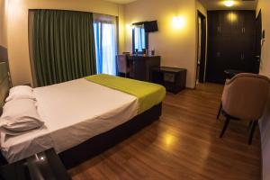Postel nebo postele na pokoji v ubytování Giotis Boutique Hotel