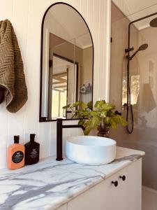 a bathroom with a sink and a mirror at Hilltop Haven Darlington in Darlington
