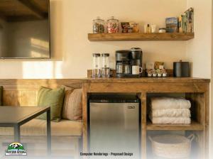 a room with a counter with a coffee maker on it at Western Riviera Lakeside Lodging in Grand Lake