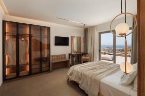 a hotel room with a bed and a window at GkF Luxury Villas in Naxos Chora +224 photos