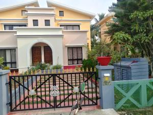 a gate in front of a house at Surabhi Gardenia 28B-C in Raichak +7 photos