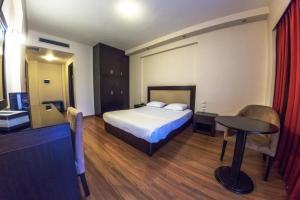 Postel nebo postele na pokoji v ubytování Giotis Boutique Hotel