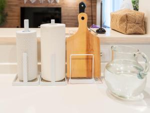 a counter top with several candles and a glass vase at 巡り宿香西本町-最大10名 in Takamatsu +38 photos