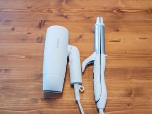 twointendo wii game controllers sitting on a wooden table at 巡り宿香西本町-最大10名 in Takamatsu
